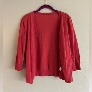Women’s coral cardigan. Unsure of size or brand, but I think it’s a size medium